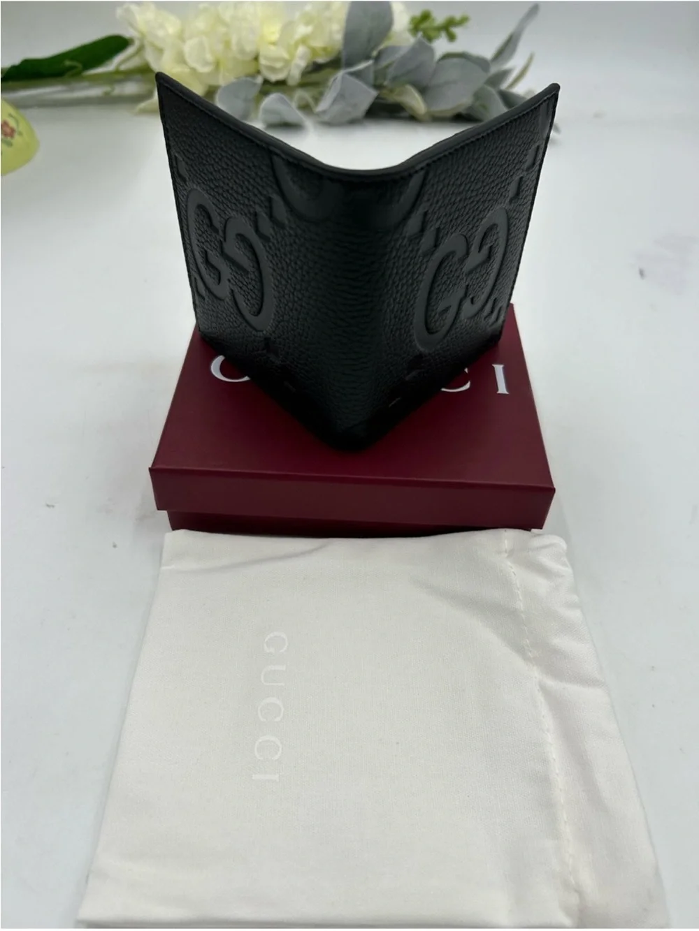 Gucci Black jumbo GG Leather Bifold Wallet.